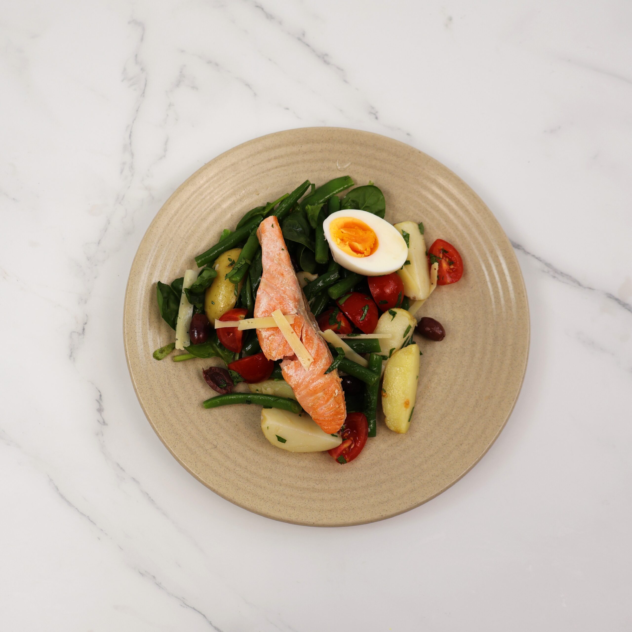 Warm salmon niçoise salad, green beans, olives, cherry tomatoes, organic egg