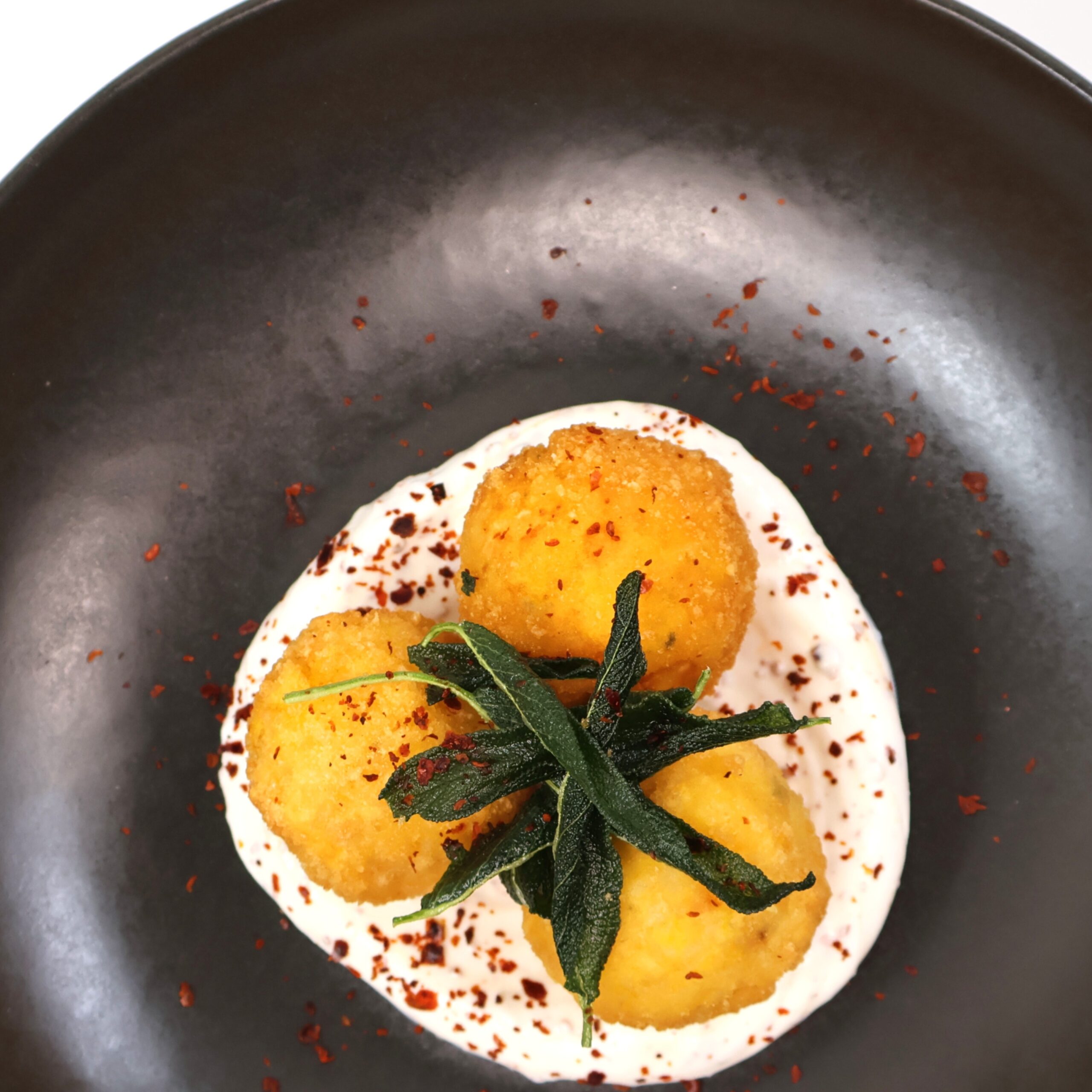 Roasted pumpkin & sage arancini, Aleppo pepper labneh