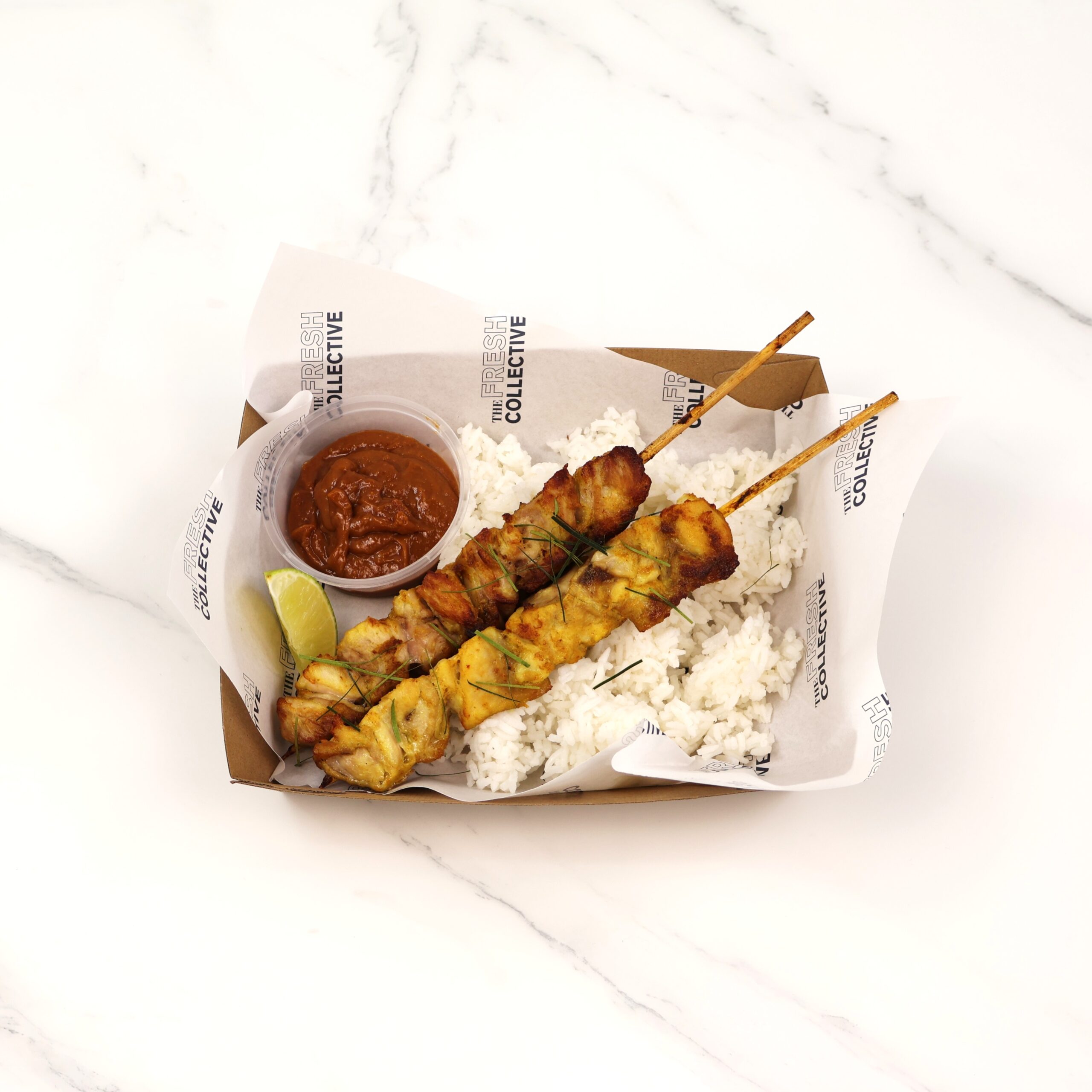 Satay chicken skewers, macadamia satay sauce, lime leaf